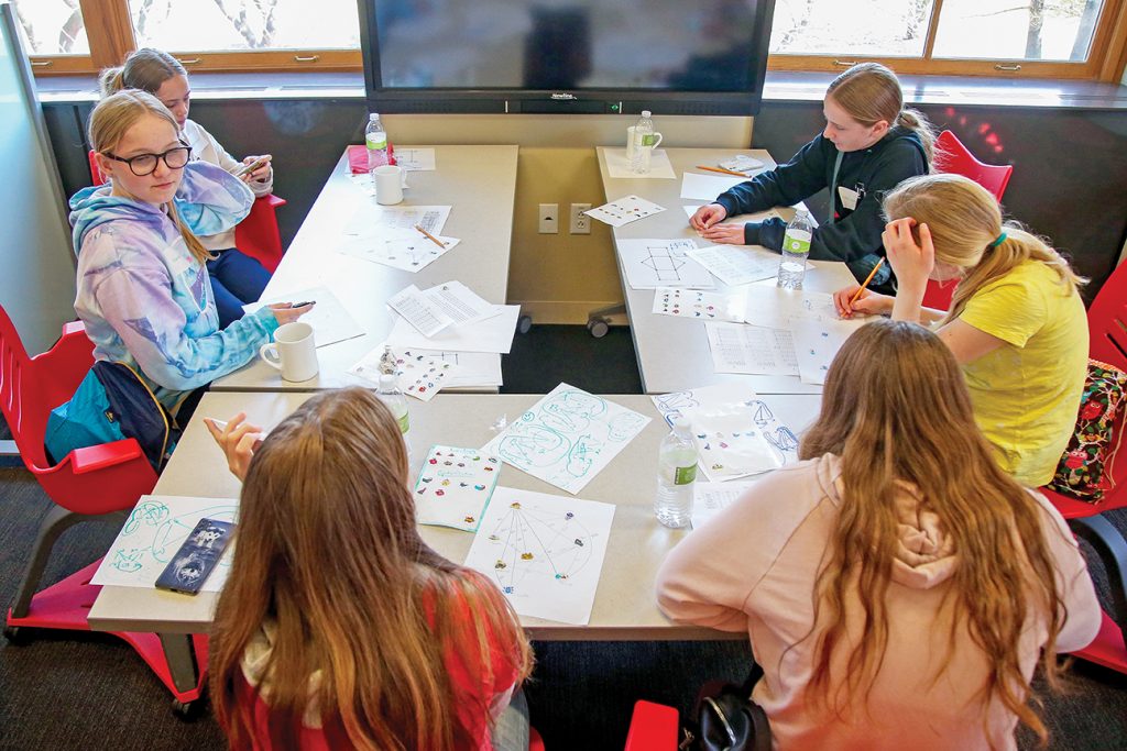 Students around a table at SK Day